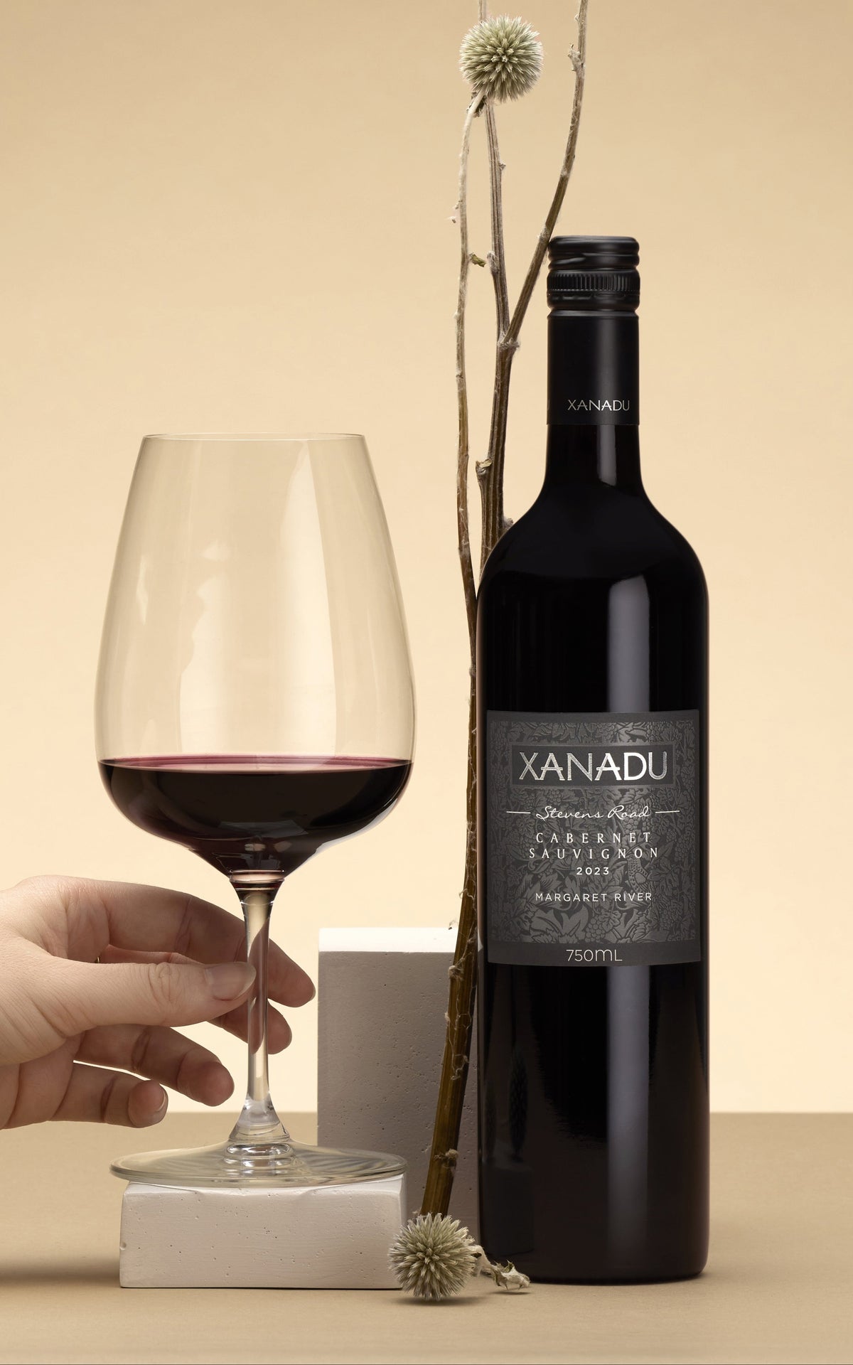Stevens Road Cabernet Sauvignon alongside glass and flower